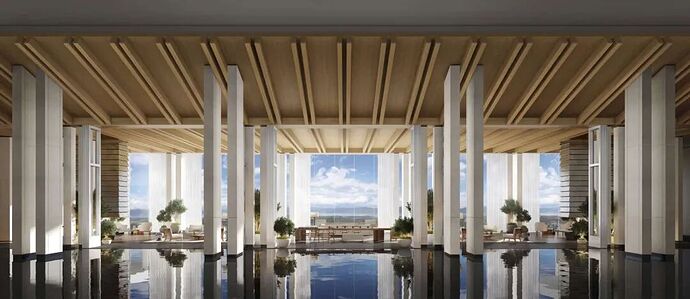 View from lobby with large windows, blue skies and clouds